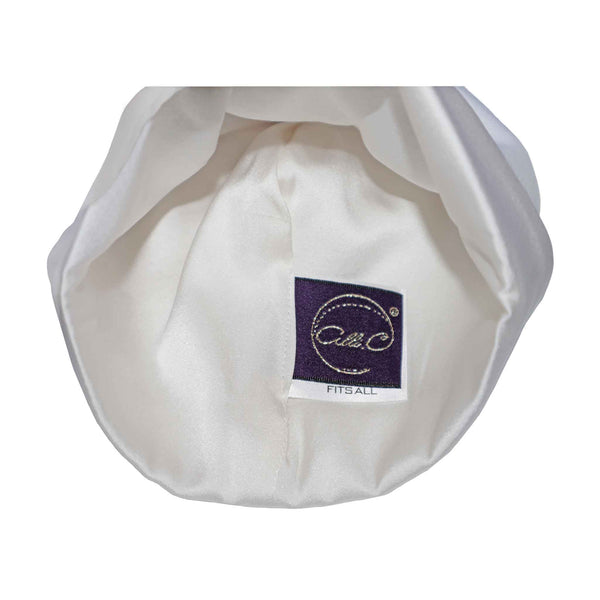 Alli.C, signature silk charmeuse lining inside of our white 100% Pima Cotton gender-neutral baby hat. Crafted to aid in preventing baby bald spots.  