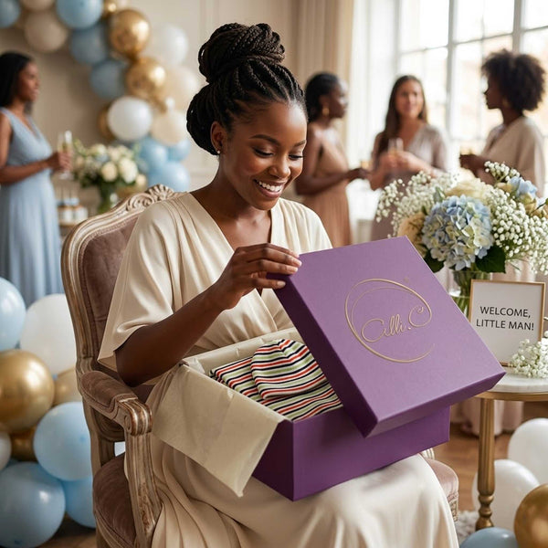 Mom-to-be opening Alli.C gift box with striped baby blanket & matching baby hat with silk lining inside at baby shower.