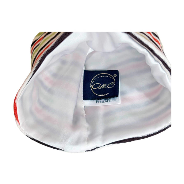 Alli.C signature white silk charmeuse lining featured inside of the boys striped baby hat.